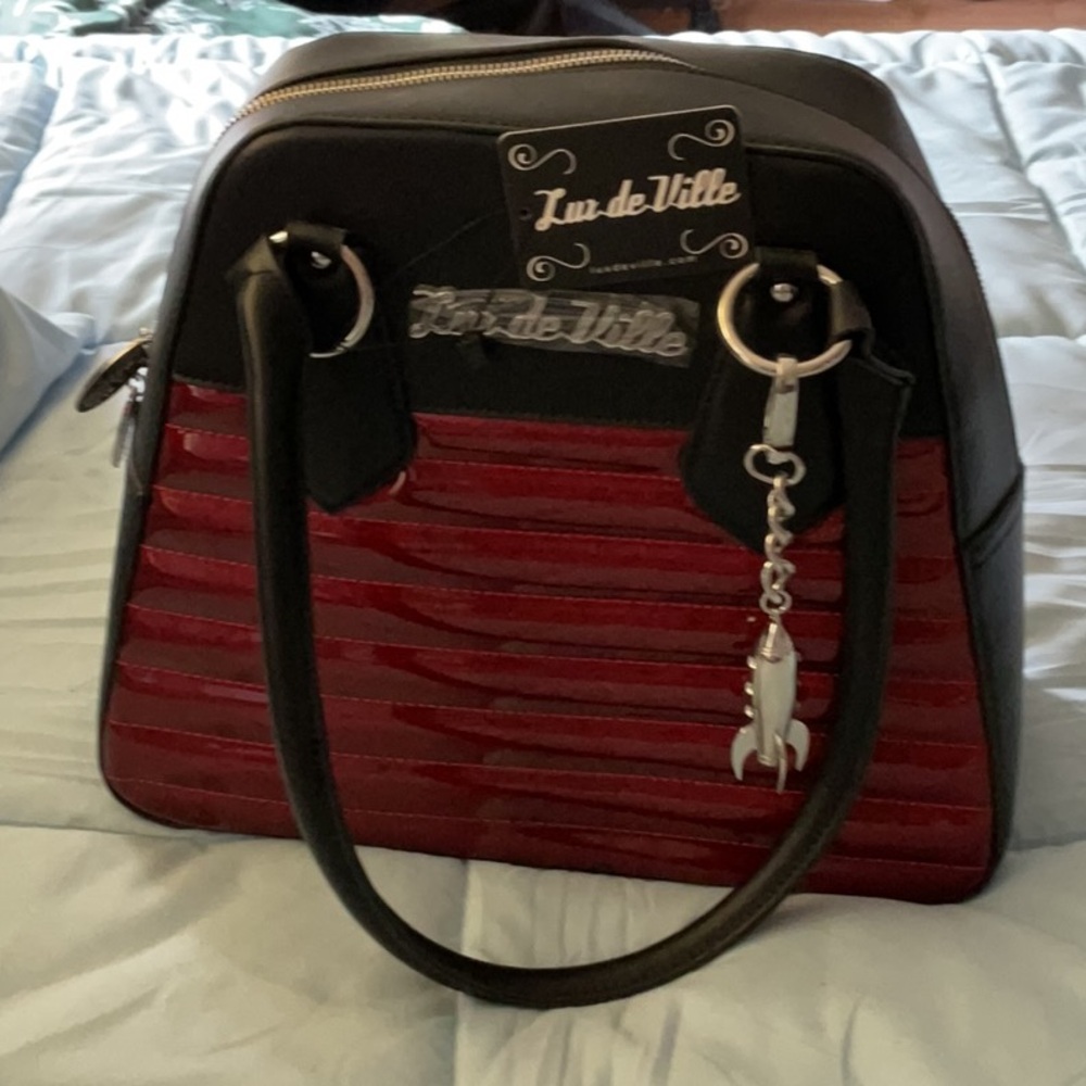 Lux de Ville Black and Red Satchel with Elegant Detailing